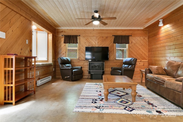 261 Franks Cove Rd, Brevard, NC 28712 - living room featuring a baseboard radiator, ceiling fan, wooden ceiling, wooden walls, and concrete flooring