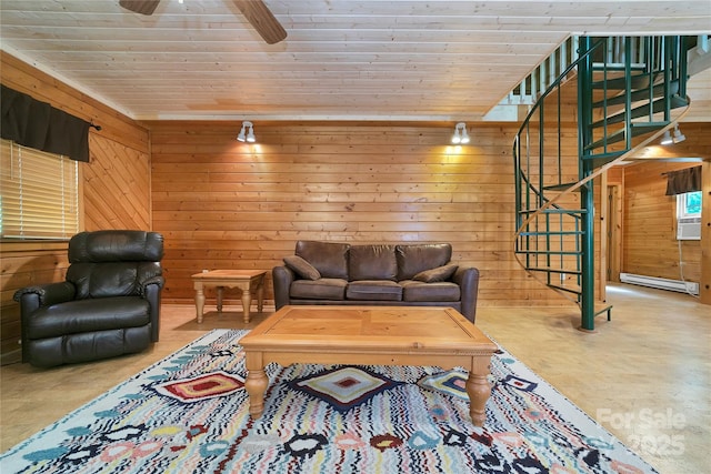 261 Franks Cove Rd, Brevard, NC 28712 - living area featuring stairway, wooden walls, finished concrete flooring, ceiling fan, and baseboard heating
