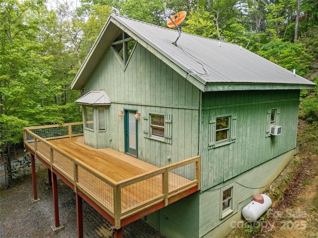 261 Franks Cove Rd, Brevard, NC 28712 - back of property with a deck, metal roof, a wooded view, and cooling unit