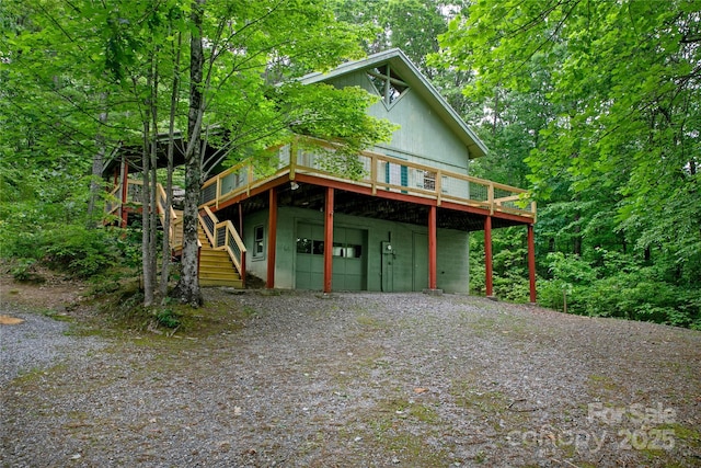 261 Franks Cove Rd, Brevard, NC 28712 - rustic home featuring a deck, driveway, and stairs