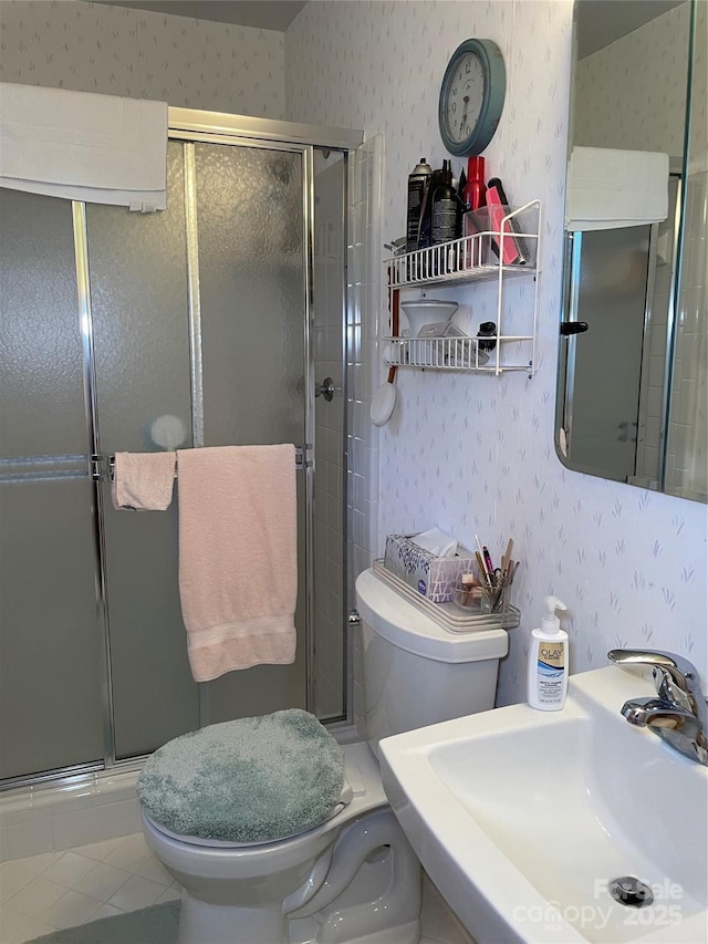 5806 Whitingham Dr, Charlotte, NC 28215 - bathroom featuring wallpapered walls, a sink, toilet, and a shower stall
