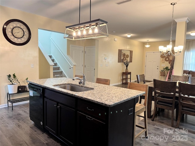 750 Fraternity Row, Kannapolis, NC 28081 - kitchen featuring black dishwasher, dark cabinetry, a sink, a chandelier, and dark wood-style flooring