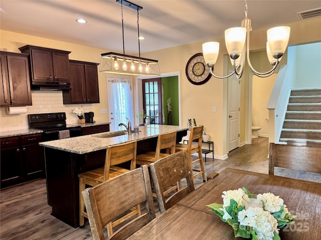 750 Fraternity Row, Kannapolis, NC 28081 - kitchen with electric range, a sink, under cabinet range hood, dark wood-style flooring, and recessed lighting