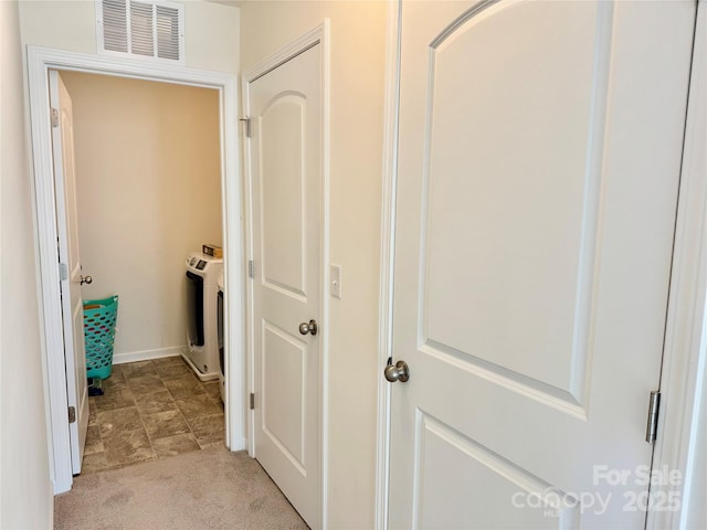 750 Fraternity Row, Kannapolis, NC 28081 - corridor featuring washer / clothes dryer, light carpet, and baseboards