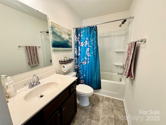 750 Fraternity Row, Kannapolis, NC 28081 - full bath with vanity, shower / bathtub combination with curtain, toilet, stone finish flooring, and baseboards