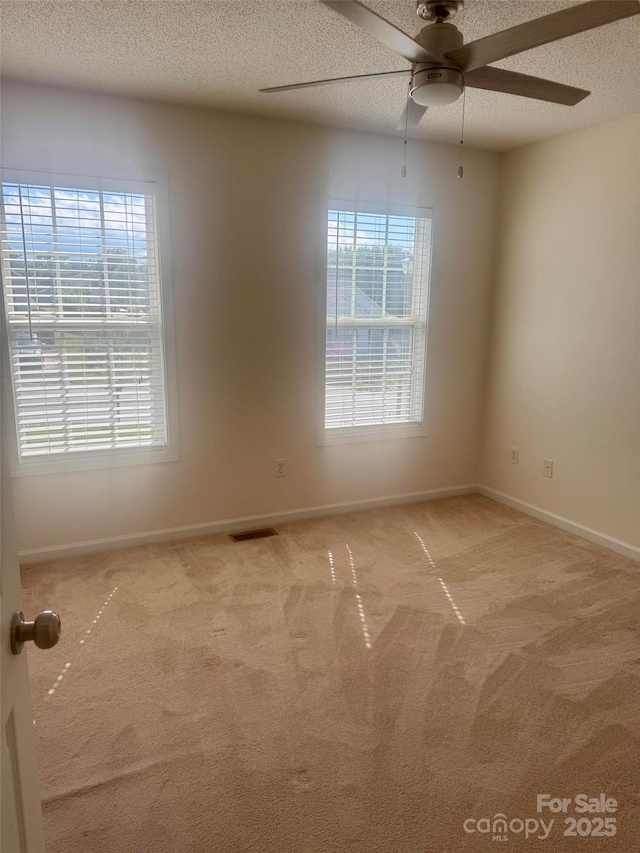 1743 Silver Stream Dr, Rock Hill, SC 29730 - carpeted spare room with ceiling fan, a textured ceiling, and baseboards