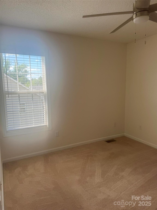 1743 Silver Stream Dr, Rock Hill, SC 29730 - carpeted spare room featuring a textured ceiling, ceiling fan, and baseboards