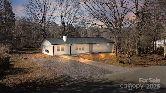5520 Chestnut Dr, Hickory, NC 28602 - ranch-style house featuring a chimney and asphalt driveway