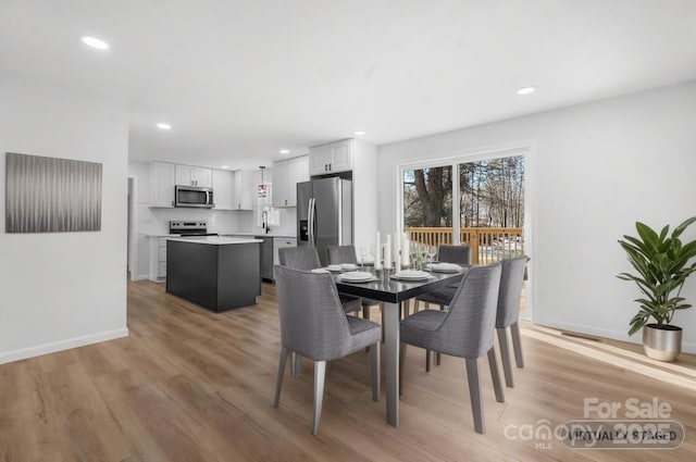 5520 Chestnut Dr, Hickory, NC 28602 - dining area with recessed lighting, light wood-style floors, and baseboards