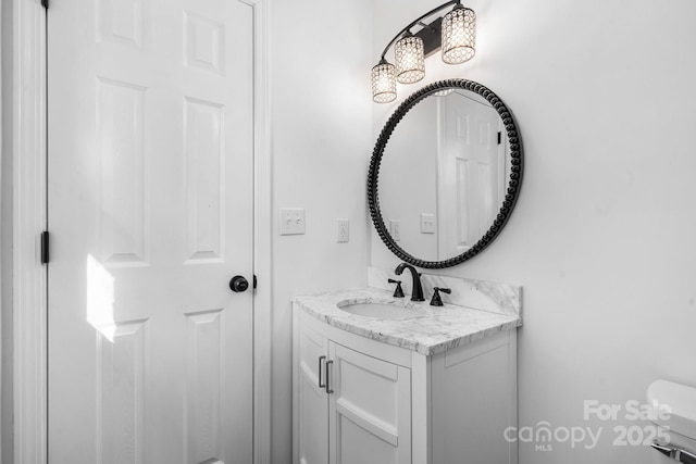5520 Chestnut Dr, Hickory, NC 28602 - bathroom with vanity, toilet, and a chandelier