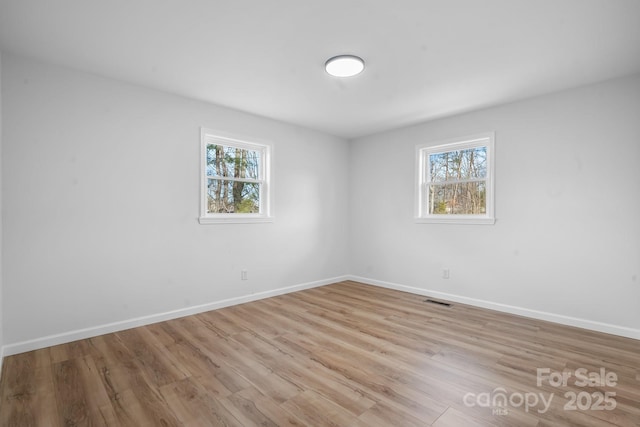 5520 Chestnut Dr, Hickory, NC 28602 - spare room with plenty of natural light, baseboards, and light wood-style flooring