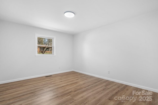5520 Chestnut Dr, Hickory, NC 28602 - spare room with wood finished floors and baseboards