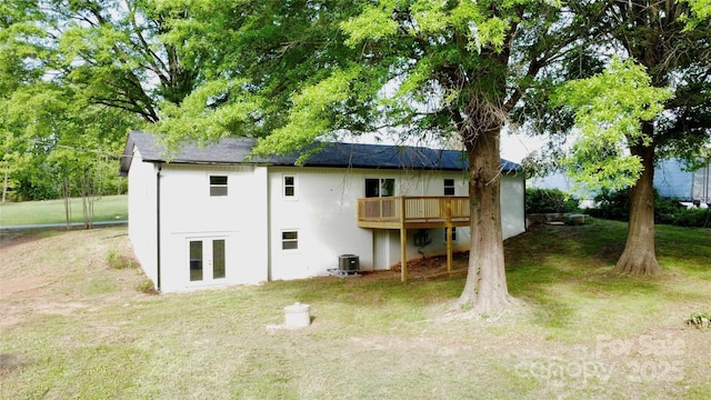 5520 Chestnut Dr, Hickory, NC 28602 - back of property with french doors, a wooden deck, a lawn, central air condition unit, and stucco siding