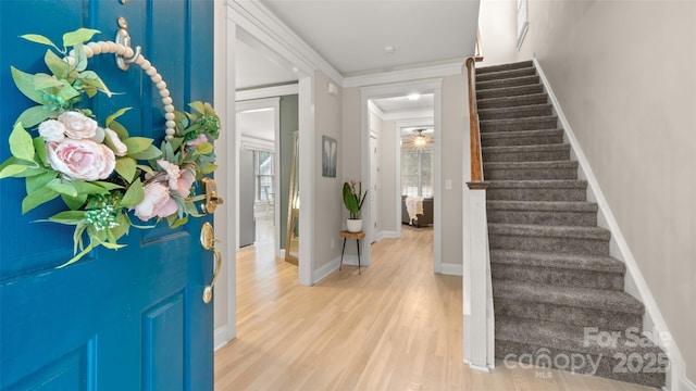 6129 Caseys Side Way, Fort Mill, SC 29708 - entryway featuring stairs, light wood-style floors, baseboards, and crown molding