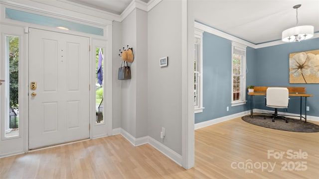 6129 Caseys Side Way, Fort Mill, SC 29708 - entrance foyer featuring ornamental molding, wood finished floors, baseboards, and a chandelier