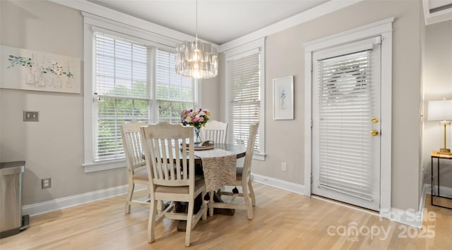 6129 Caseys Side Way, Fort Mill, SC 29708 - dining area with light wood-style flooring, a chandelier, and healthy amount of natural light