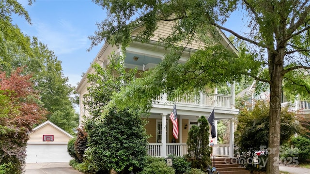 6129 Caseys Side Way, Fort Mill, SC 29708 - obstructed view of property featuring a porch, an outdoor structure, a balcony, and a detached garage