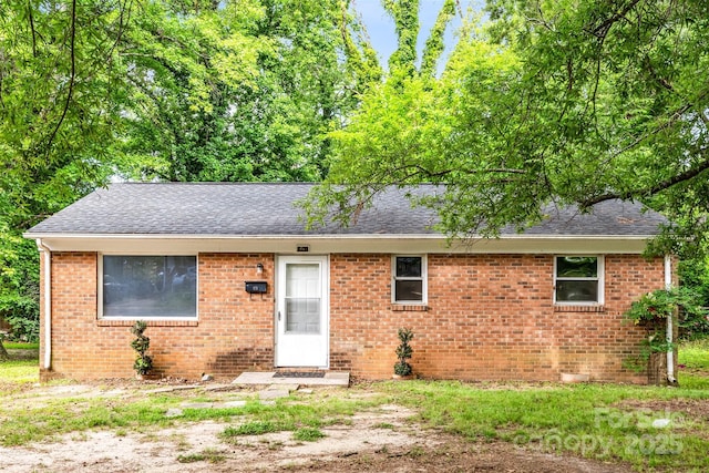 1310 Caldwell St, Greensboro, NC 27406 - single story home with roof with shingles and brick siding