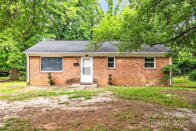1310 Caldwell St, Greensboro, NC 27406 - view of front of house featuring brick siding and roof with shingles