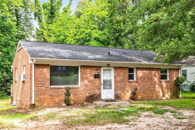 1310 Caldwell St, Greensboro, NC 27406 - view of front facade with roof with shingles and brick siding
