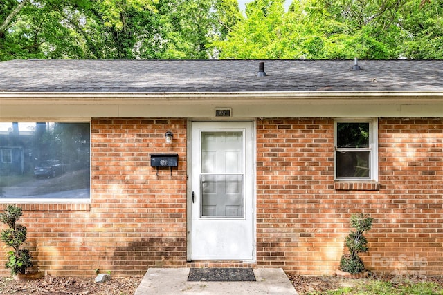 1310 Caldwell St, Greensboro, NC 27406 - entrance to property with brick siding and a shingled roof