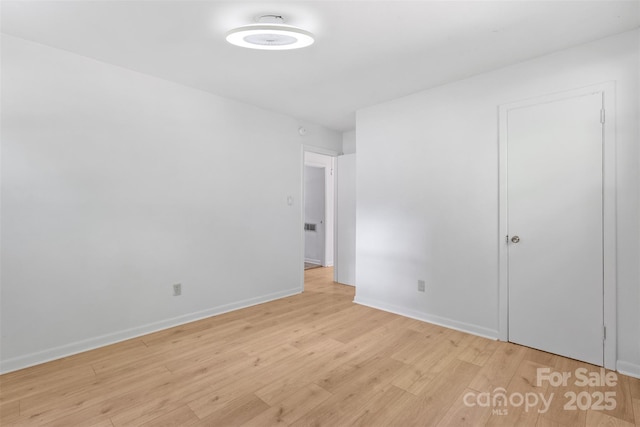 1310 Caldwell St, Greensboro, NC 27406 - unfurnished room with light wood-type flooring and baseboards