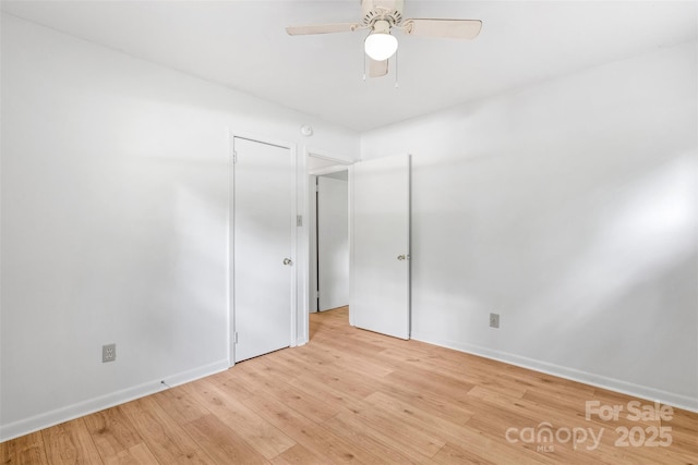1310 Caldwell St, Greensboro, NC 27406 - spare room with light wood-style flooring, a ceiling fan, and baseboards