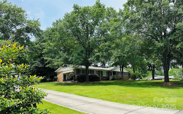 2618 Pineview Dr, Lancaster, SC 29720 - ranch-style house with a front yard, brick siding, and driveway