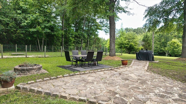 2618 Pineview Dr, Lancaster, SC 29720 - view of patio featuring a fire pit, outdoor dining space, and grilling area
