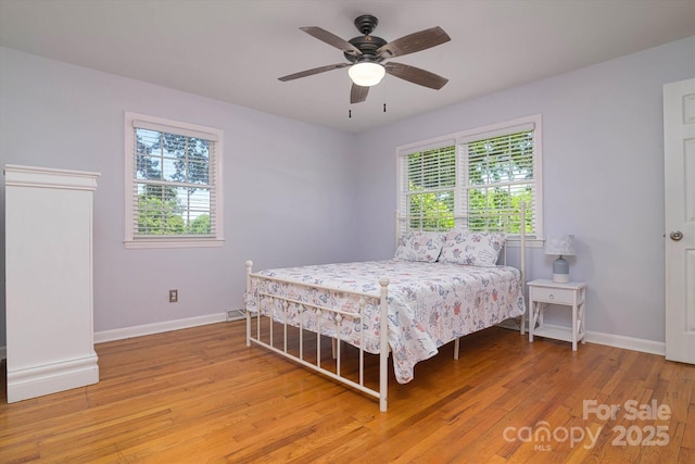 2618 Pineview Dr, Lancaster, SC 29720 - bedroom featuring multiple windows, baseboards, and light wood-style flooring