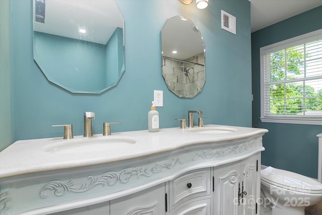 2618 Pineview Dr, Lancaster, SC 29720 - full bathroom featuring double vanity, toilet, and a shower