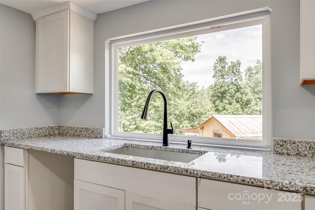 1224 Martin Rd, Hickory Grove, SC 29717 - kitchen with a sink, white cabinetry, and light stone counters