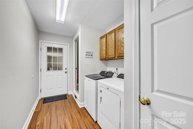 2005 Schofield Pl, Salisbury, NC 28144 - laundry room with cabinet space, independent washer and dryer, baseboards, and dark wood finished floors