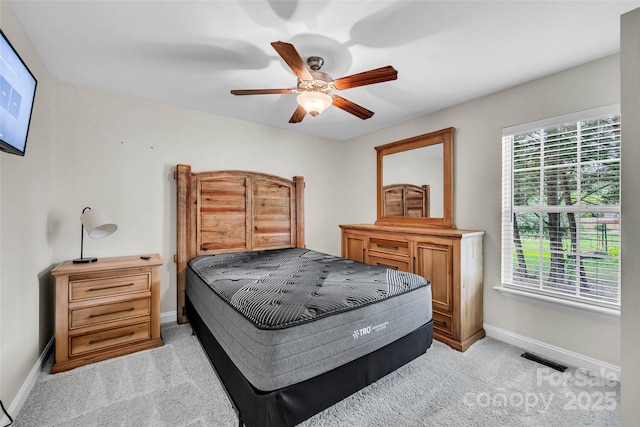 2005 Schofield Pl, Salisbury, NC 28144 - bedroom featuring baseboards, light carpet, and a ceiling fan