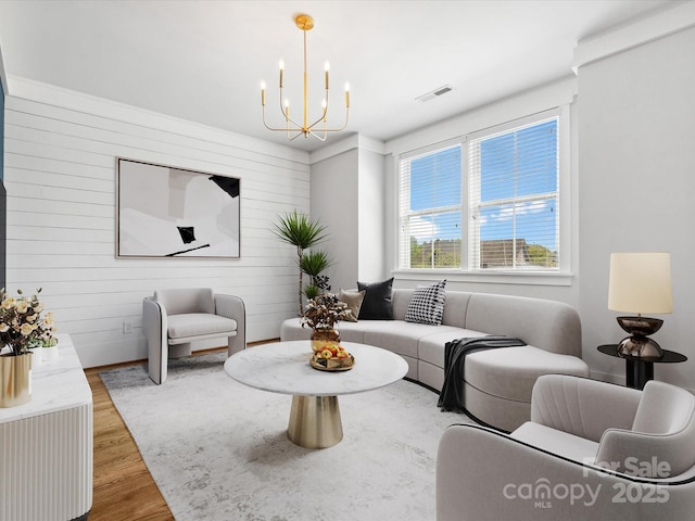 807 Herrons Ferry Rd, Rock Hill, SC 29730 - living room featuring a chandelier, wood finished floors, and wooden walls