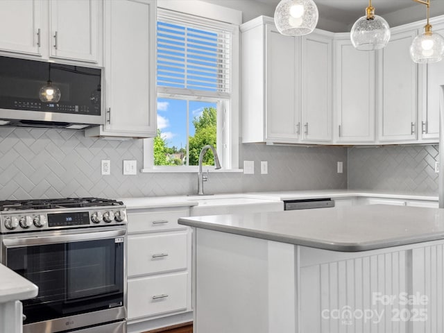 807 Herrons Ferry Rd, Rock Hill, SC 29730 - kitchen featuring stainless steel appliances, white cabinets, a sink, and tasteful backsplash