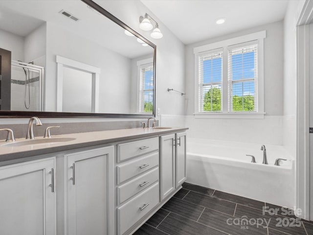 807 Herrons Ferry Rd, Rock Hill, SC 29730 - bathroom with double vanity, a garden tub, a shower stall, and recessed lighting