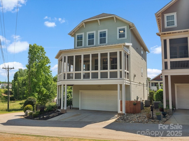 807 Herrons Ferry Rd, Rock Hill, SC 29730 - view of front facade with an attached garage, driveway, a sunroom, and cooling unit