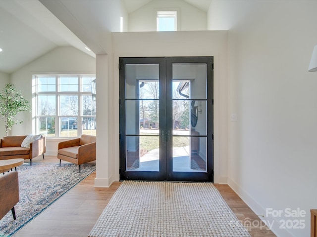 8039 Mcconnell Rd, Denver, NC 28037 - entryway featuring french doors, light wood-style floors, high vaulted ceiling, and baseboards