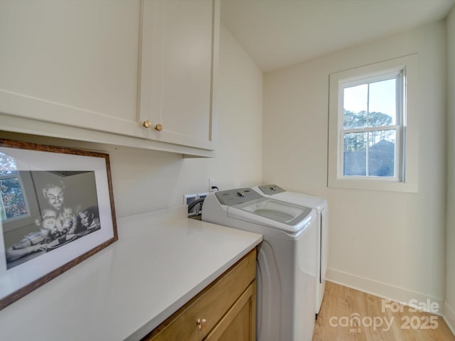 8039 Mcconnell Rd, Denver, NC 28037 - laundry area featuring cabinet space, washing machine and dryer, baseboards, and light wood-type flooring