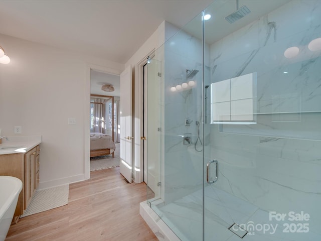 8039 Mcconnell Rd, Denver, NC 28037 - ensuite bathroom featuring a marble finish shower, wood finished floors, vanity, and baseboards