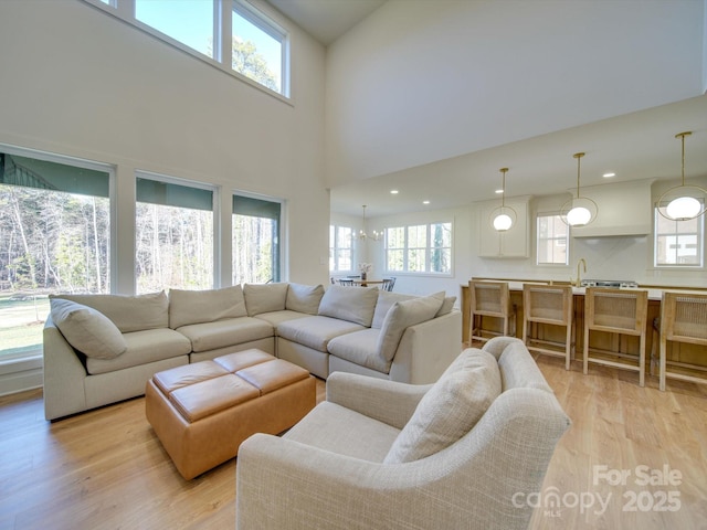 8039 Mcconnell Rd, Denver, NC 28037 - living area featuring healthy amount of natural light, light wood-style floors, recessed lighting, and a towering ceiling