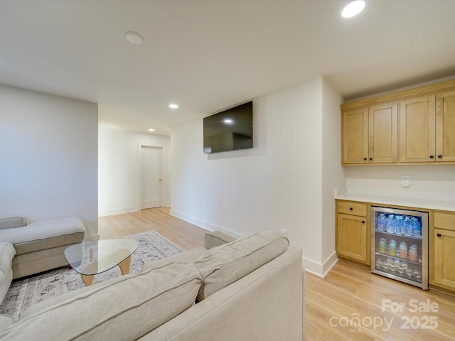 8039 Mcconnell Rd, Denver, NC 28037 - living room featuring beverage cooler, light wood-style flooring, baseboards, recessed lighting, and a dry bar