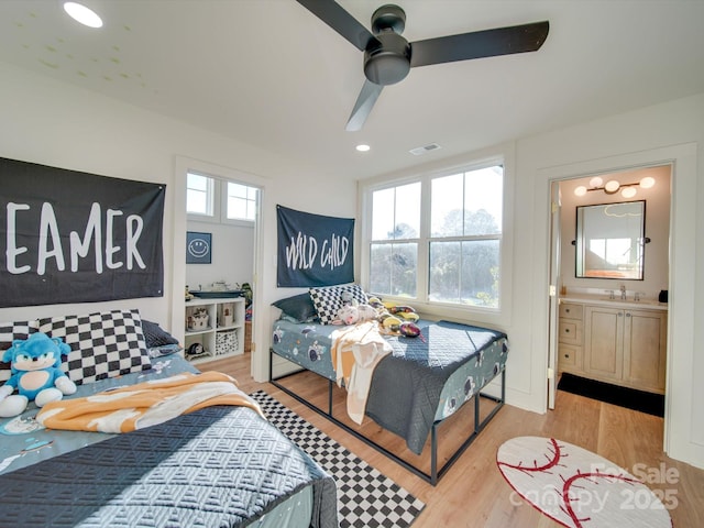 8039 Mcconnell Rd, Denver, NC 28037 - bedroom featuring wood finished floors, a sink, a ceiling fan, and ensuite bathroom