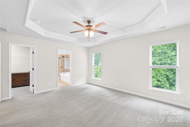 4848 Fonthill Ln, Charlotte, NC 28210 - empty room featuring a tray ceiling, ceiling fan, carpet, baseboards, and a smoke detector