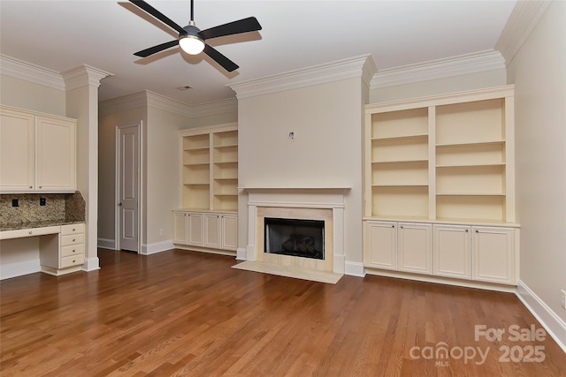 17210 Sulky Plough Rd Unit 1206, Charlotte, NC 28277 - unfurnished living room with ceiling fan, baseboards, wood finished floors, crown molding, and a fireplace