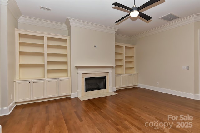 17210 Sulky Plough Rd Unit 1206, Charlotte, NC 28277 - unfurnished living room featuring dark wood-style flooring, baseboards, a ceiling fan, ornamental molding, and a high end fireplace