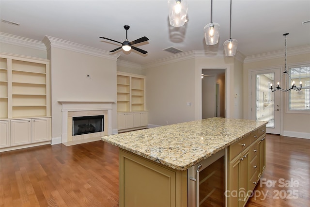 17210 Sulky Plough Rd Unit 1206, Charlotte, NC 28277 - kitchen featuring wine cooler, a ceiling fan, wood finished floors, crown molding, and a high end fireplace