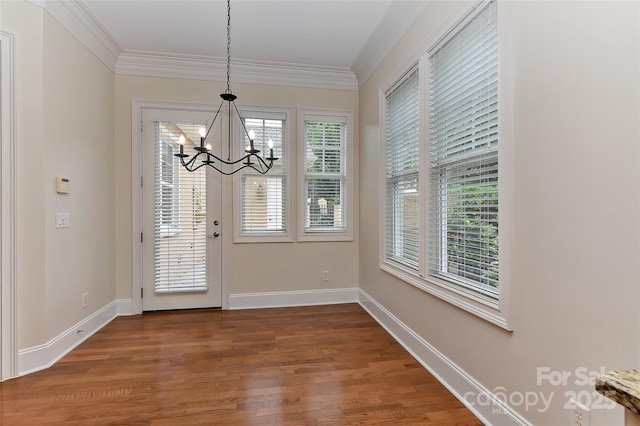 17210 Sulky Plough Rd Unit 1206, Charlotte, NC 28277 - unfurnished dining area featuring a chandelier, crown molding, wood finished floors, and baseboards