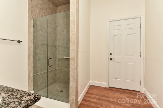 17210 Sulky Plough Rd Unit 1206, Charlotte, NC 28277 - full bathroom featuring a shower stall, baseboards, and wood finished floors